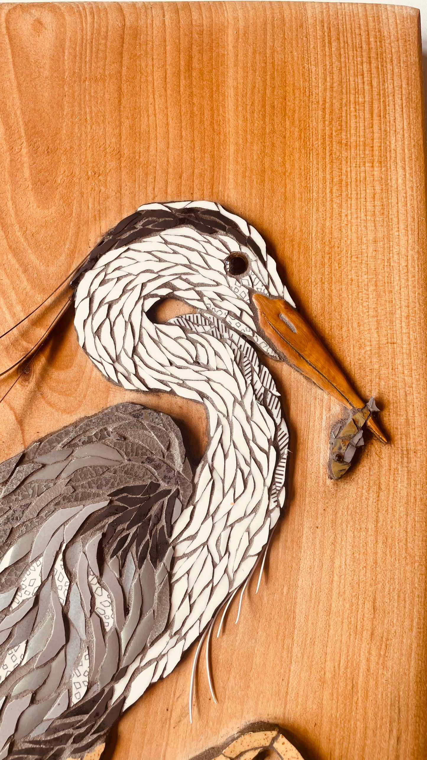 Heron and fish on Wood
