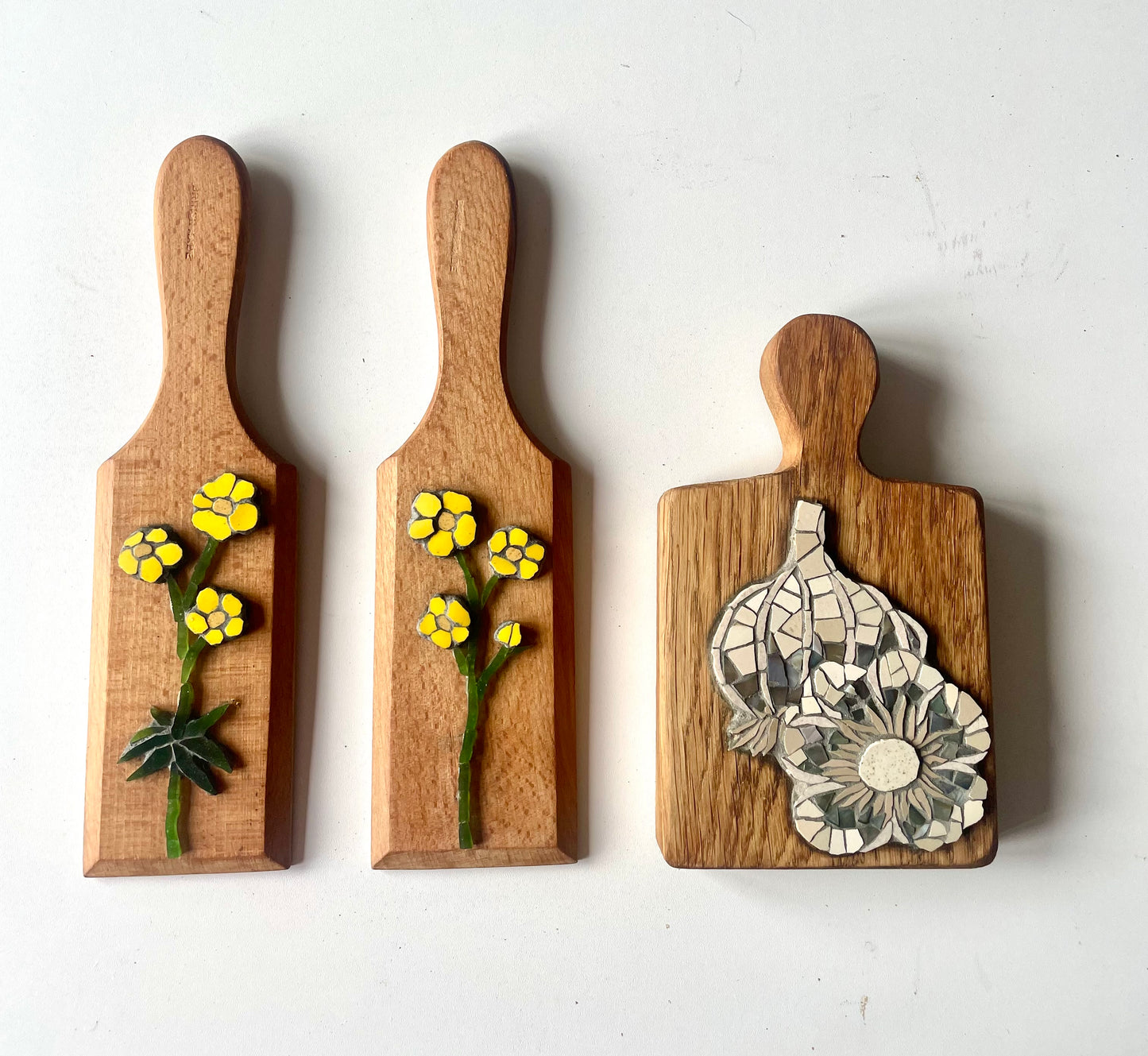 Buttercup with leaf on vintage butter pat