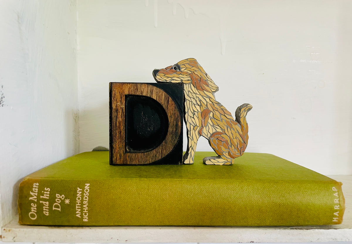 Sitting Dog on Vintage wooden Letter press D
